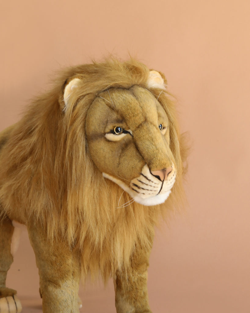 A Ride-On Lion plush toy with a full mane stands against a light beige background, facing slightly right—expertly hand sewn and offered as a final sale.