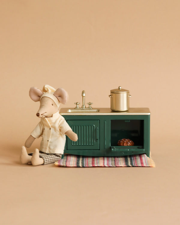 Miniature mouse doll with miniature kitchen