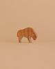 The Ostheimer Bison, Small, is a handcrafted wooden bison with smooth features and minimal detailing, displayed on a plain light brown background—ideal for fans of artisanal toys.