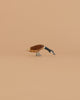 The Ostheimer Goose - Canada, Long Neck is a small handcrafted wooden figurine with its head bent down, made from sustainably sourced wood and inspired by classic Ostheimer toy design. Set against a plain light brown background.