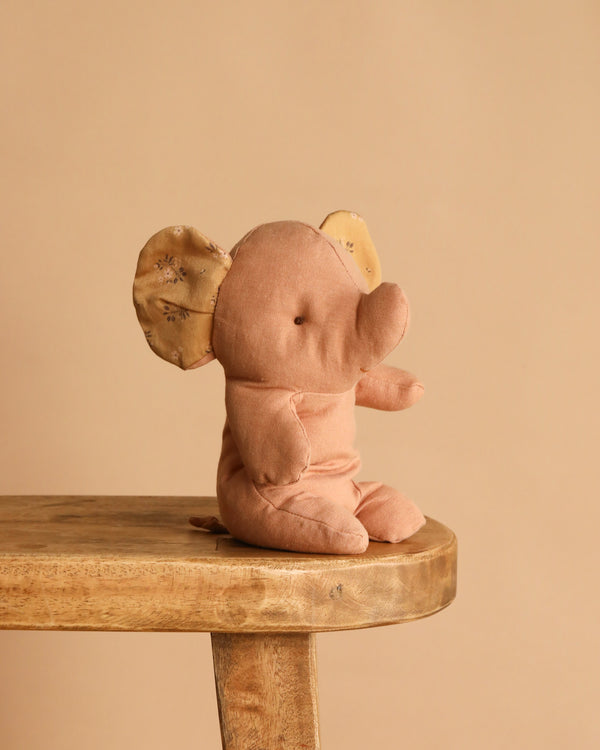The Maileg Elephant, Small - Powder is a soft, light brown stuffed toy with patterned ears, crafted from recycled polyester plush. Perfect for lovers of soft fabric animals, it sits beautifully on any shelf or bench.