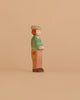 The Ostheimer Young Farmer is a handcrafted wooden figurine featuring a green shirt, brown pants, and a beige hat—an ideal sustainable toy for collectors and imaginative play.