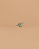 The Ostheimer Bird - Blue Tit is a small wooden figurine with vibrant green, blue, and yellow markings, perfect for imaginative play or as a charming addition to your handcrafted Ostheimer toys collection.