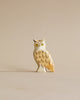 A handmade wooden owl figurine from the Handmade Holzwald Woodland Animals Set, featuring painted yellow eyes and detailed brown feathers.