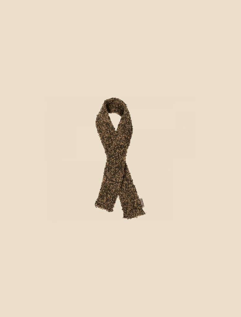 A Maileg Puppy - Knitted Scarf with a textured pattern lies flat against a light beige background. The scarf is folded in a loop with the ends hanging down, creating a simple, cozy look—perfect for adding to your dog's wardrobe for those chilly walks.