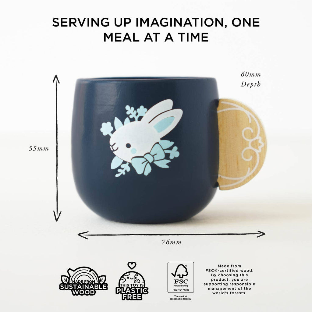 A Cutlery & Dinner Set dark blue mug with a white bunny illustration and a round wooden handle for pretend play, measuring 55mm high, 76mm wide, and 60mm deep, featuring logos for sustainable, plastic-free, and FSC-certified wood.