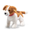 A Steiff Snuffy Dog Plush Puppy, 11" with white and brown fur, featuring distinctive black eyes and a red collar, posed against a white background. This machine washable plush ensures easy cleaning and maintenance.