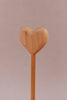 Introducing the Handmade Wooden Heart Magic Wand, featuring a beautifully carved heart from cherry wood, exquisitely polished atop a sleek stick.