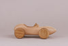 Introducing the Handmade Wooden Race Car, crafted from beech wood with intricately designed wheels. This toy car boasts an ultra-smooth finish and is elegantly treated with natural linseed oil for a sleek touch.