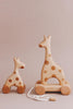 Introducing the Handmade Wooden Mini Giraffe Push Toy, a delightful push toy perfect for little explorers.