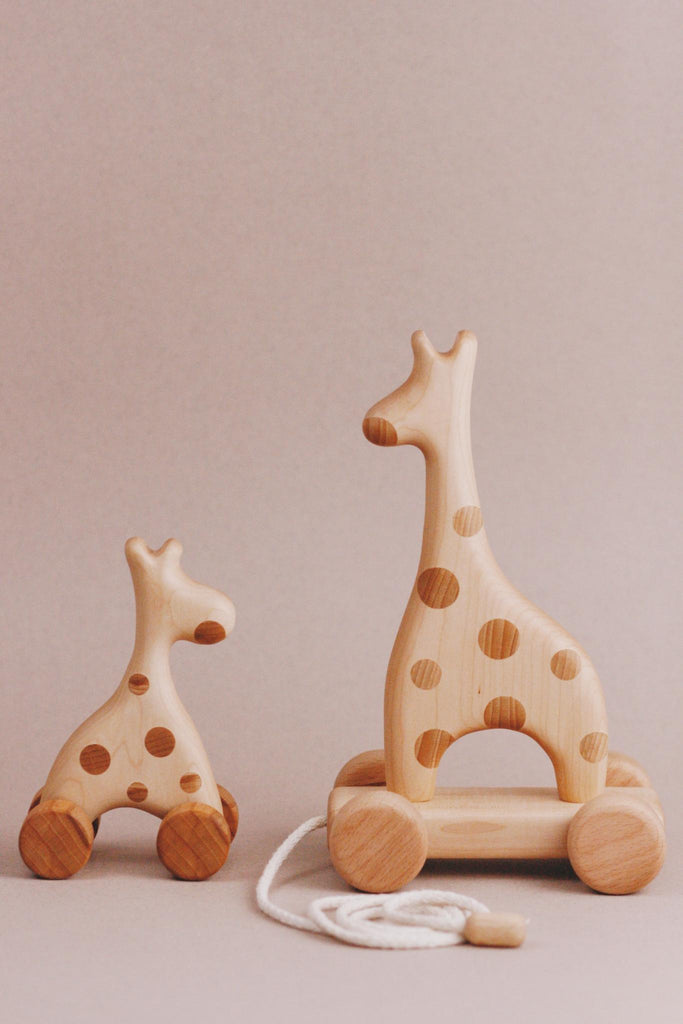 Introducing the Handmade Wooden Mini Giraffe Push Toy, a delightful push toy perfect for little explorers.