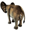 The Ride-On Elephant - Final Sale is a plush elephant toy standing on all fours, seen from behind and slightly to the side, with a fabric tag near its tail. Handcrafted for realism, it's brown with darker shading and a black tuft at the tail's end.