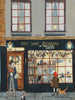 Illustration of a bookshop with “The Book Exchange” sign, people and a dog outside, and festive windows—a perfect holiday gift for book lovers: The Book Exchange - 1000 Piece Jigsaw Puzzle.