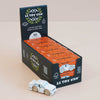 A display box holds several packages of the No. 21 GT120 William | Made in England toy car by Le Toy Van, each labeled “Limited Edition Made in England.” In front of the box sits a small white wooden racing car with wooden wheels, capturing the nostalgic charm of a vintage toy automobile.