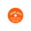 A round, orange badge featuring the text "spiel gut" at the top and "vom arbeitsausschuss kinderspiel + spielzeug ausgezeichnet recommended" in white letters is often seen on products such as the Teddy Hermann Black Cat Stuffed Animal. This badge signifies a recommendation from the German Committee for Children's Play and Toys.