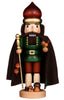 The Christian Ulbricht Collectible Wooden Nutcracker - Forest King, made in Germany, features a green coat, brown cape, staff and bird in hand, mushrooms at its feet, a large round hat, and a painted bearded face.
