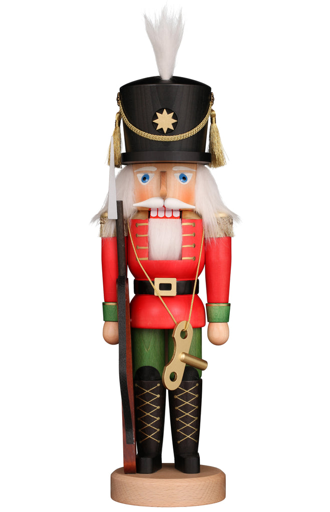 The Christian Ulbricht Collectible Wooden Nutcracker - Toy Soldier features a red and green uniform with gold accents, white hair, a black hat with a gold star, and holds a rifle and wind-up key. Handcrafted in Germany.