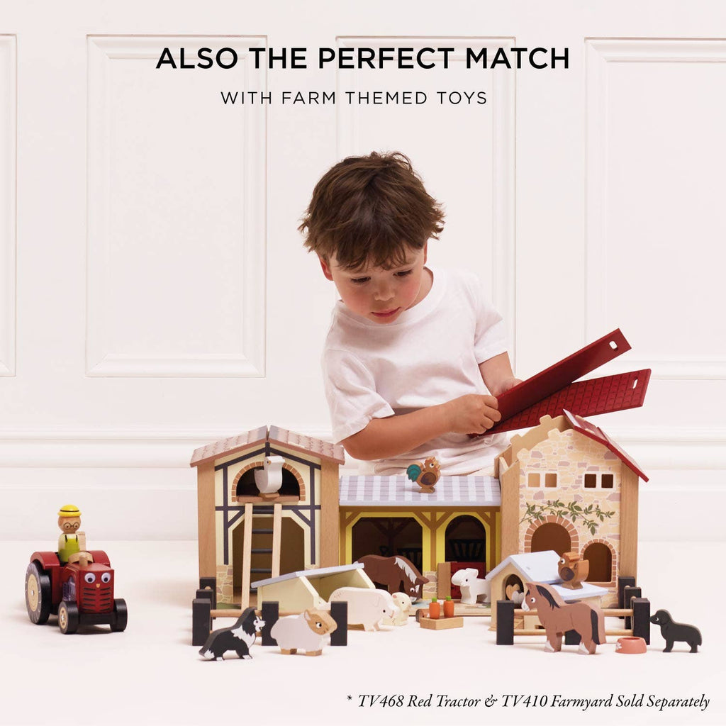 A young child plays with the eco-friendly Farmyard Stacking Animals and Bag—wooden, farm-themed stacking toys—set against a plain, light-colored background.
