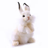 The White Bunny Stuffed Animal features lifelike, hand-sewn details with black-tipped ears, a pink nose, and fluffy fur. It sits upright against a plain white background.