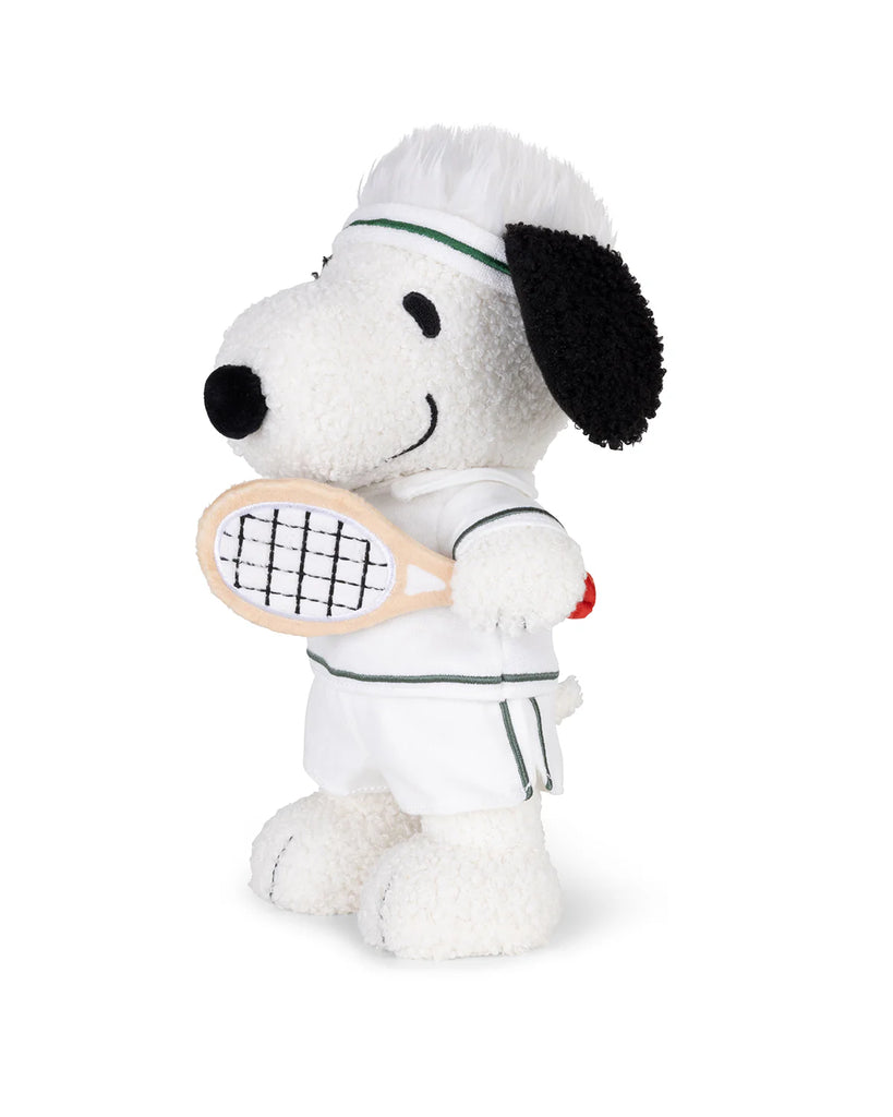 The Plush Peanuts Snoopy Tennis features Snoopy in a white tennis outfit and headband, smiling and holding a racket—an adorable plush for any Peanuts fan.