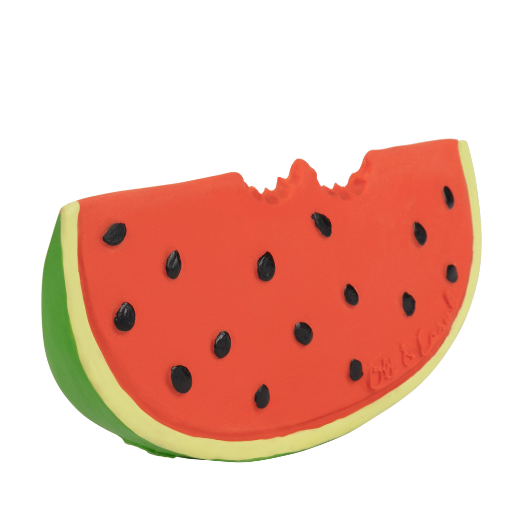 Wally the Watermelon Teether is a colorful natural rubber baby toy shaped like a bitten watermelon slice, with red flesh, black seeds, and a green rind—ideal for sensory play and teething.