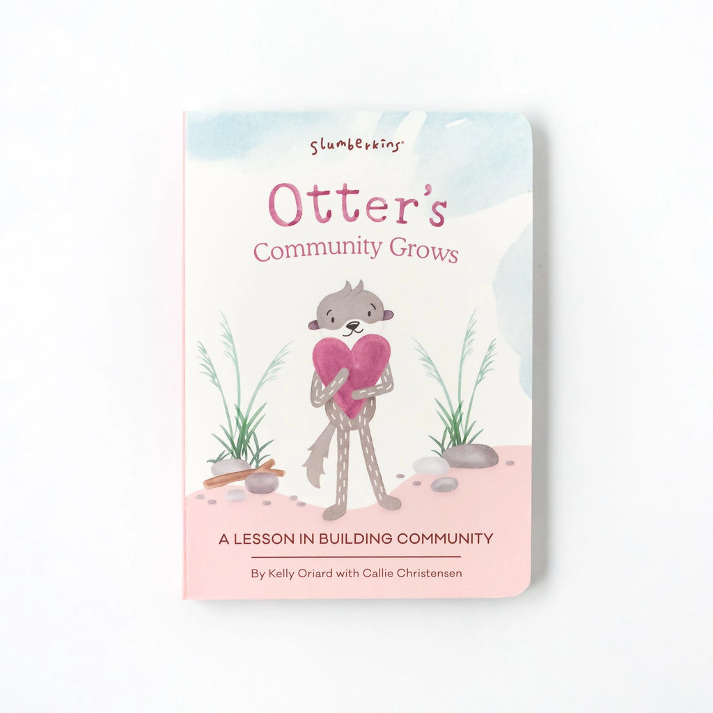 A children's book titled "Slumberkins A Lesson in Caring Board Book Set" with an illustration of a smiling otter holding a shovel, surrounded by plants, on a pastel background. This book, offering a