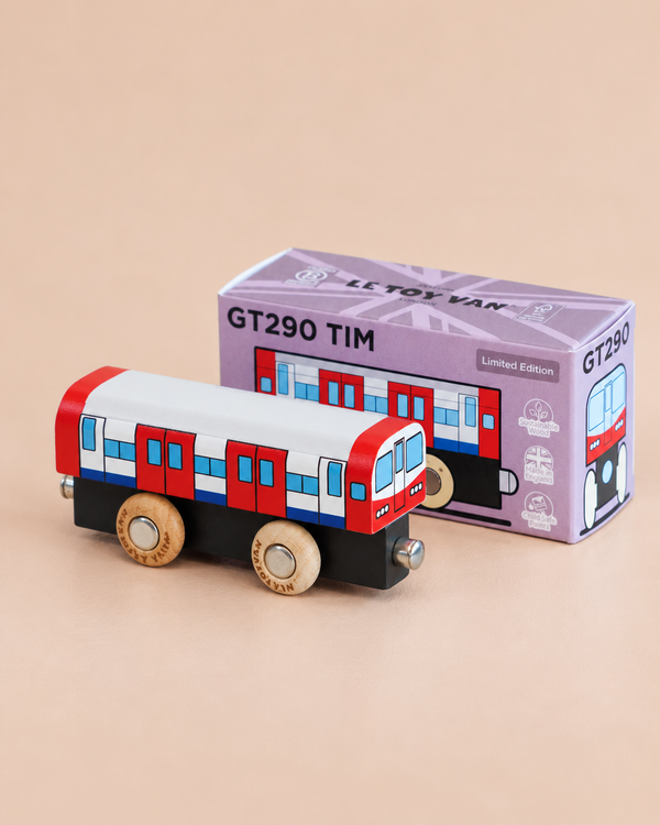 A toy train painted red, white, and blue stands in front of a purple box labeled “No. 48 GT290 Tim | Made in England.” Perfect for imaginative play, the box features an image of the toy and displays the words “Limited Edition” on the top right corner.