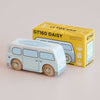 A retro toy wooden van, painted light blue, sits in front of its yellow packaging box labeled “No. 29 GT160 Daisy | Made in England.” The box features an illustration of the van and the text “Limited Edition,” making it perfect for nostalgic play or as a vintage wooden campervan collector’s piece.