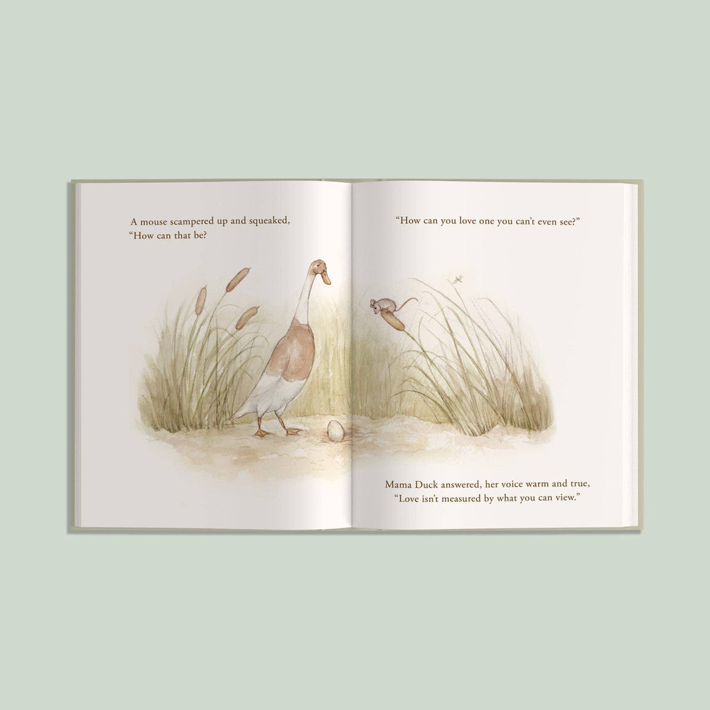 An open copy of “I’ve Loved You from the Start,” a children’s picture book, displays a duck and a mouse talking in a grassy field with text on both pages. The background is light green, and the soft, gentle illustrations make this story perfect as a new baby gift or for quiet moments shared between parent and child.