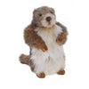 A hand-sewn plush toy of a standing otter featuring realistic brown and white fur, with its small hands held close to its chest, isolated on a white background.