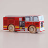 A small, toy wooden fire engine—No. 44 GT270 Quinn, made in England—painted red with yellow and black details, labeled “Fire Dept” and “Engine Co. 6” on the side, with two visible wooden wheels—perfect for imaginative adventures and daring rescue missions.