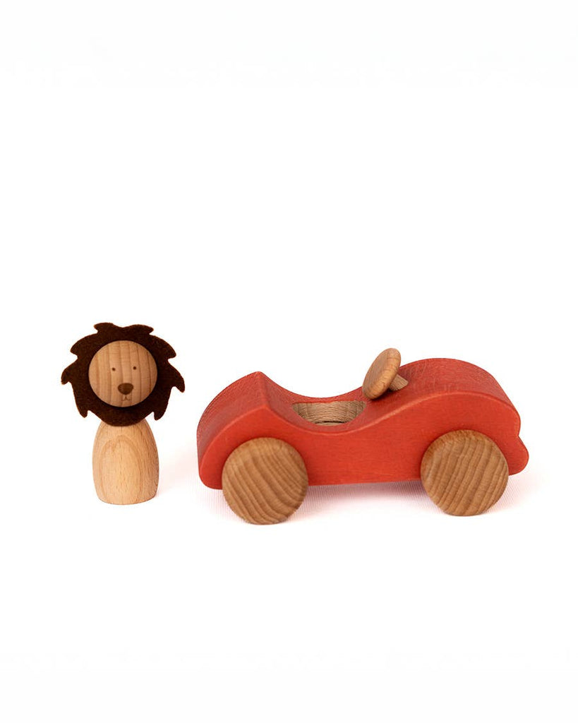 The Sabo Concept Car with Lion features a wooden lion figure alongside a red car toy with natural wheels and a mini steering wheel, inspiring imaginative play on a white background.