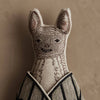 The Coral & Tusk Bat Surprise Doll is a decorative bat plush toy with embroidered facial features, pointy ears, fabric wings, and a striped cloak, set against a textured beige background. Ships in one week.