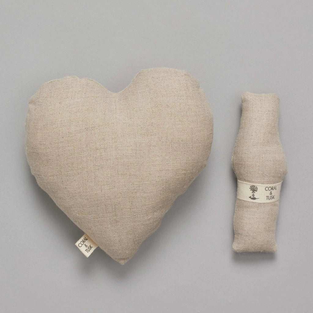 A large Coral & Tusk Fox Heart Pocket Valentine and a small cloth roll labeled "Cohai Talk," both in soft beige tones, displayed on a plain gray background.