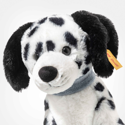 The Steiff Oskar Dalmatian Dog is an 11-inch plush with black spots, floppy black ears, and a soft white body, featuring a gray collar and a yellow tag on its ear.