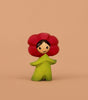 The Bumbu Handmade Wooden Flower Child Poppy features a red flower-shaped head, smiling face, and green body—perfect for Montessori toys or small world play—standing against a plain beige background.