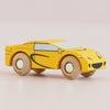 A yellow wooden sports car—No. 19 GT105 Louis, made in England—is shown with black detailing and wooden wheels, angled to the right on a light surface; a classic Le Toy Van creation.