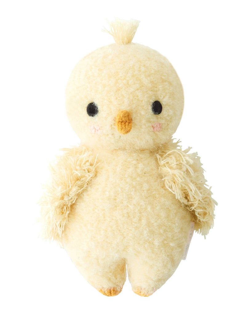The Cuddle + Kind Baby Bouclé Chick (Buttercup) is a plush yellow toy with a round body, tiny feet, and black eyes. Its tuft of fluff and soft texture make it a delightful addition to any stuffed animal collection.