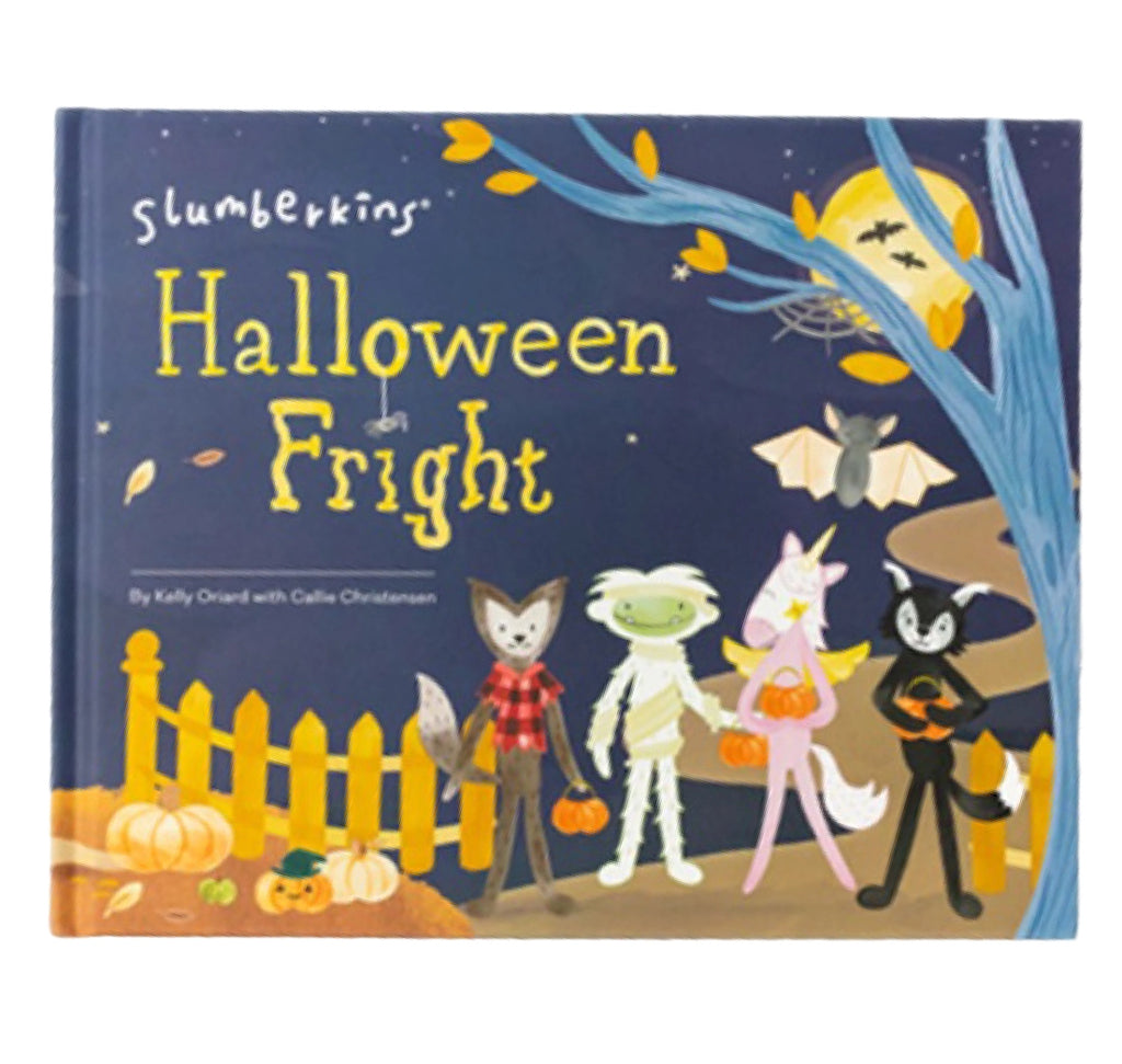 A children's book titled "Slumberkins Halloween Gift Set - Mummy Kin + Halloween Fright Book" featuring illustrated characters in costumes, including a fox, an alien, and a cat, with flying bats and a glow-in-the-dark