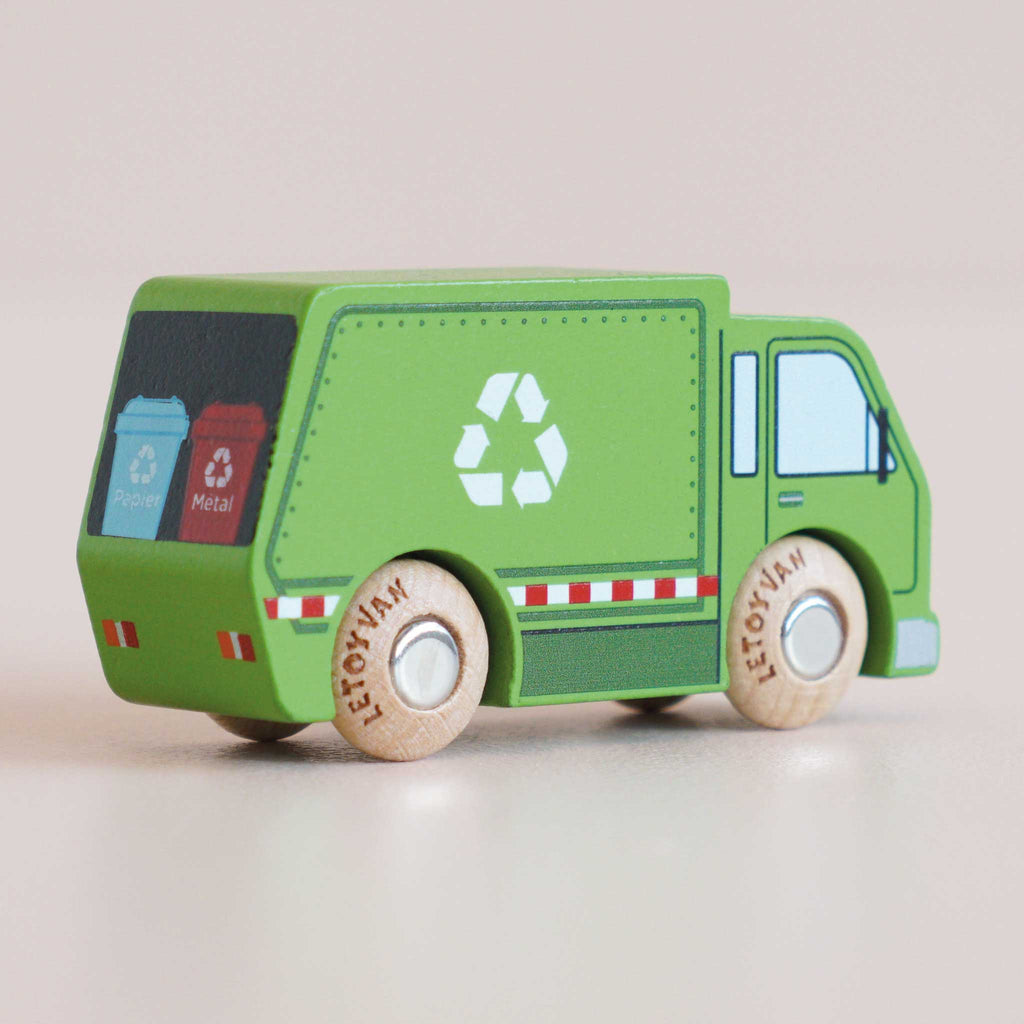 Introducing the No. 36 GT200 Rudy | Made in England: a green wooden recycling truck featuring a white recycling symbol, thoughtfully crafted as an eco-friendly toy for sustainable play. The back includes bins labeled “Paper” and “Metal,” and LETOYVAN is inscribed on its wooden wheels.