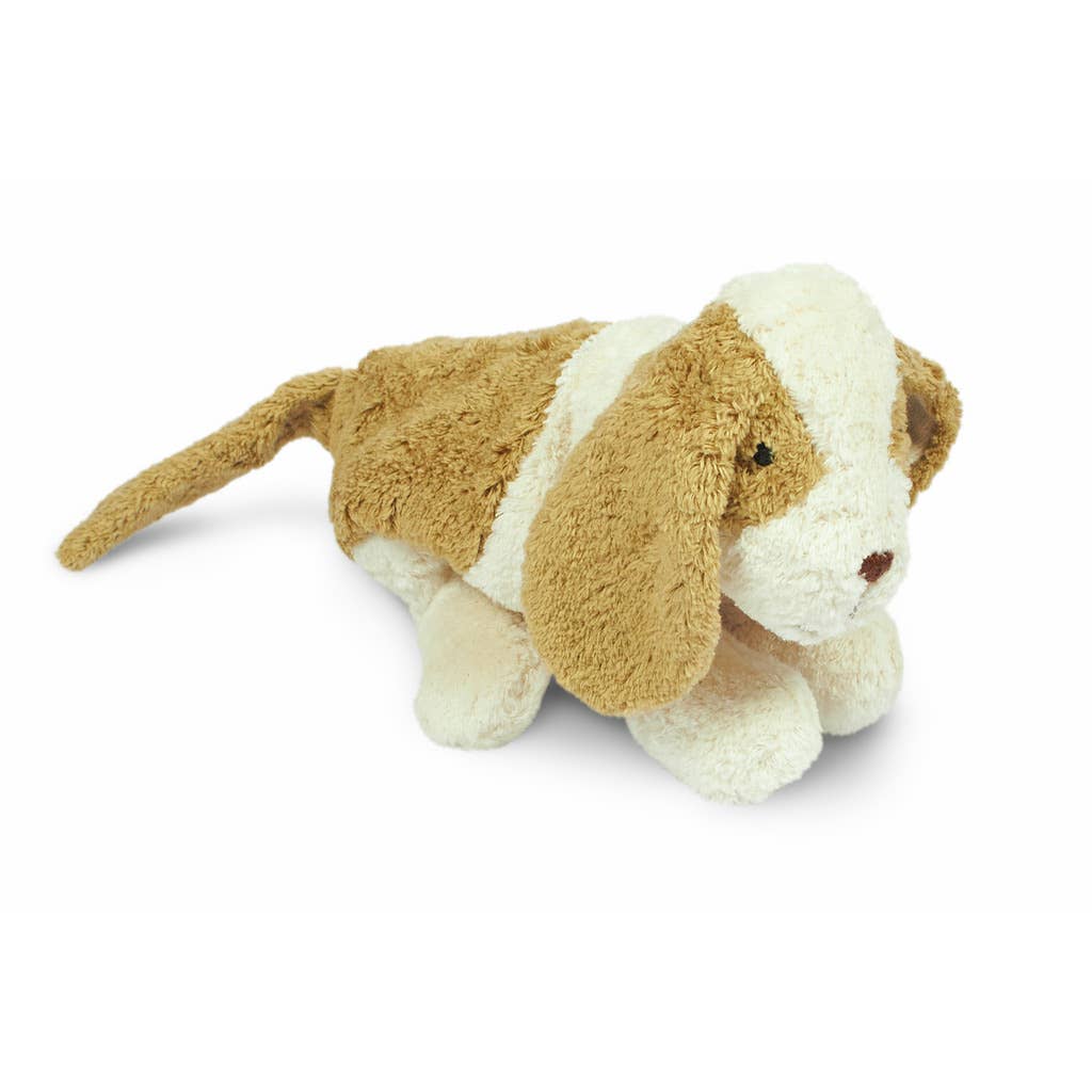 The Senger Naturwelt Cuddly Animal - Dog is a plush toy with brown and white fur, floppy ears, and a long tail, made from organic cotton and shown on all fours against a plain white background.