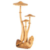 The Small Wooden Mushroom Trio features three miniature mushrooms of different heights, each crafted from light brown wood and set on a natural wooden base, forming an abstract and artistic fungi sculpture that adds a distinctive touch to your décor.
