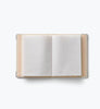 A Storybook Embroidered Small Photo Album with a beige cover and white plastic sleeves, open and empty, is centered on a plain white background.