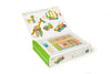 An open box of the Tegu 42 Piece Magnetic Wooden Block Set - Sunset displaying colorful wooden sticks, magnetic wheels, and example projects like a unicorn and cars, with the text "what will you make?" on the inside cover.