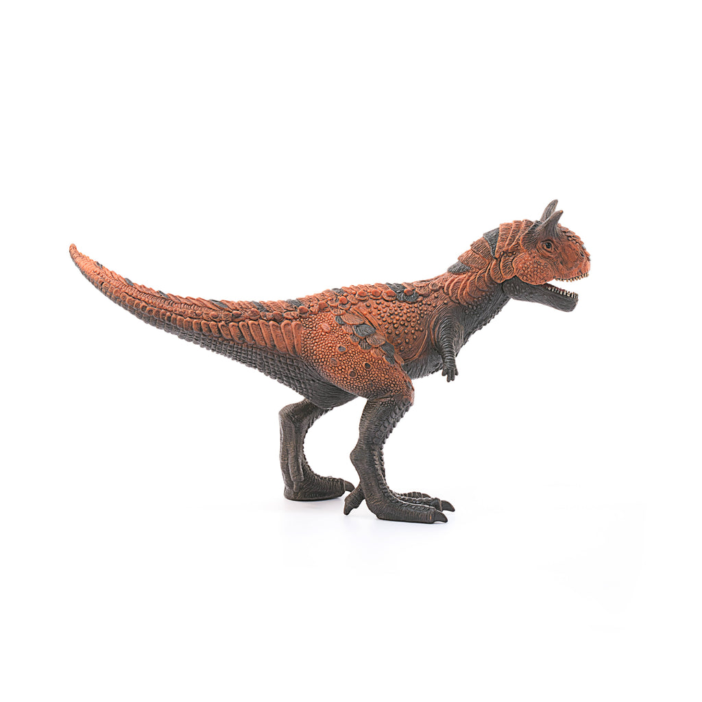 The Schleich Carnotaurus Large Realistic Dinosaur Toy With Movable Jaw features detailed orange and dark gray textured skin, stands on two legs with a long tail and small arms, and is isolated on a white background—making it an ideal educational toy for young dinosaur enthusiasts.