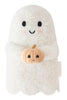 Cuddle + Kind Baby Ghost with Pumpkin is a plush, heirloom-quality ghost with a smiling face and blushing cheeks, holding a hand-knit orange and beige pumpkin, crafted from soft Peruvian cotton yarn.