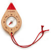 The Huckleberry Compass is a beechwood FSC wood compass shaped like a red-tipped teardrop, with cardinal directions, a visible needle on a metal pivot, and a red string—ideal for kids' outdoor adventures.