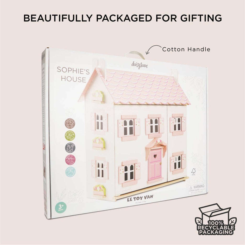Sophie's Wooden Dolls House by Le Toy Van features pastel pink and white colors, a cotton handle, FSC-certified wood, and eco-friendly 100% recyclable packaging—perfect for gifting.