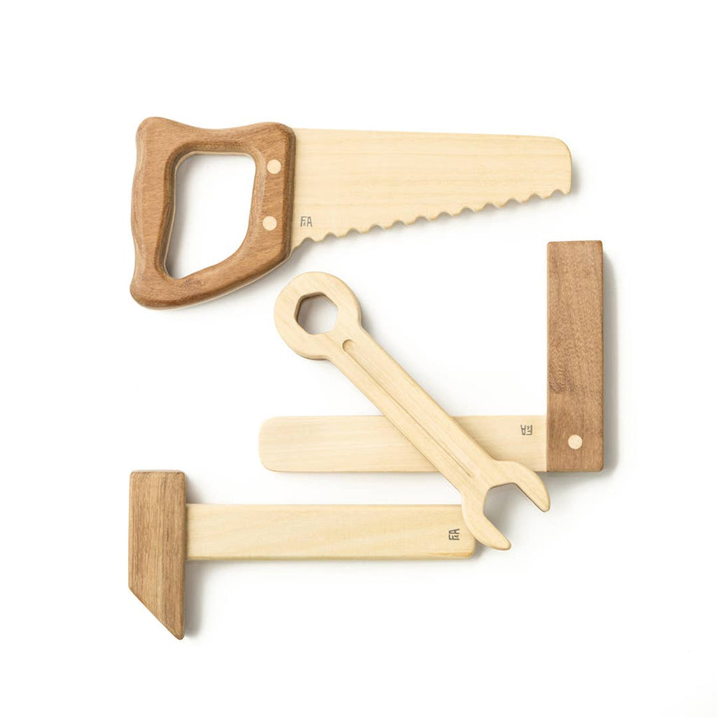 The Wooden Tool Set features four tools—saw, wrench, hammer, and square—crafted from solid rubber wood with Sapele teak wood accents and displayed on a white background for a playful, minimalist style.