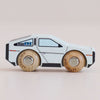The No. 23 GT130 Dexter, available for pre-order in August 2026, is a modern wooden toy car painted to resemble a futuristic silver vehicle with black accents and robust wooden wheels. Displayed in side profile against a plain background, it’s perfect for inspiring imaginative play.